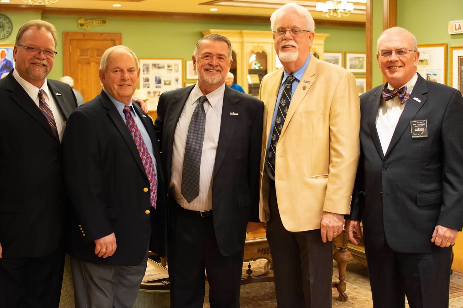 Group of men gather and smile at the Grand Lodge of Ohio Florida Reception