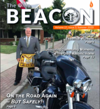 GM Newton poses with his motorcycle on the cover of the Ohio Beacon, Summer 2020 issue